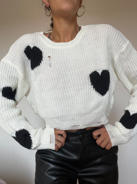 Pullover cropped con dettagli di strappi